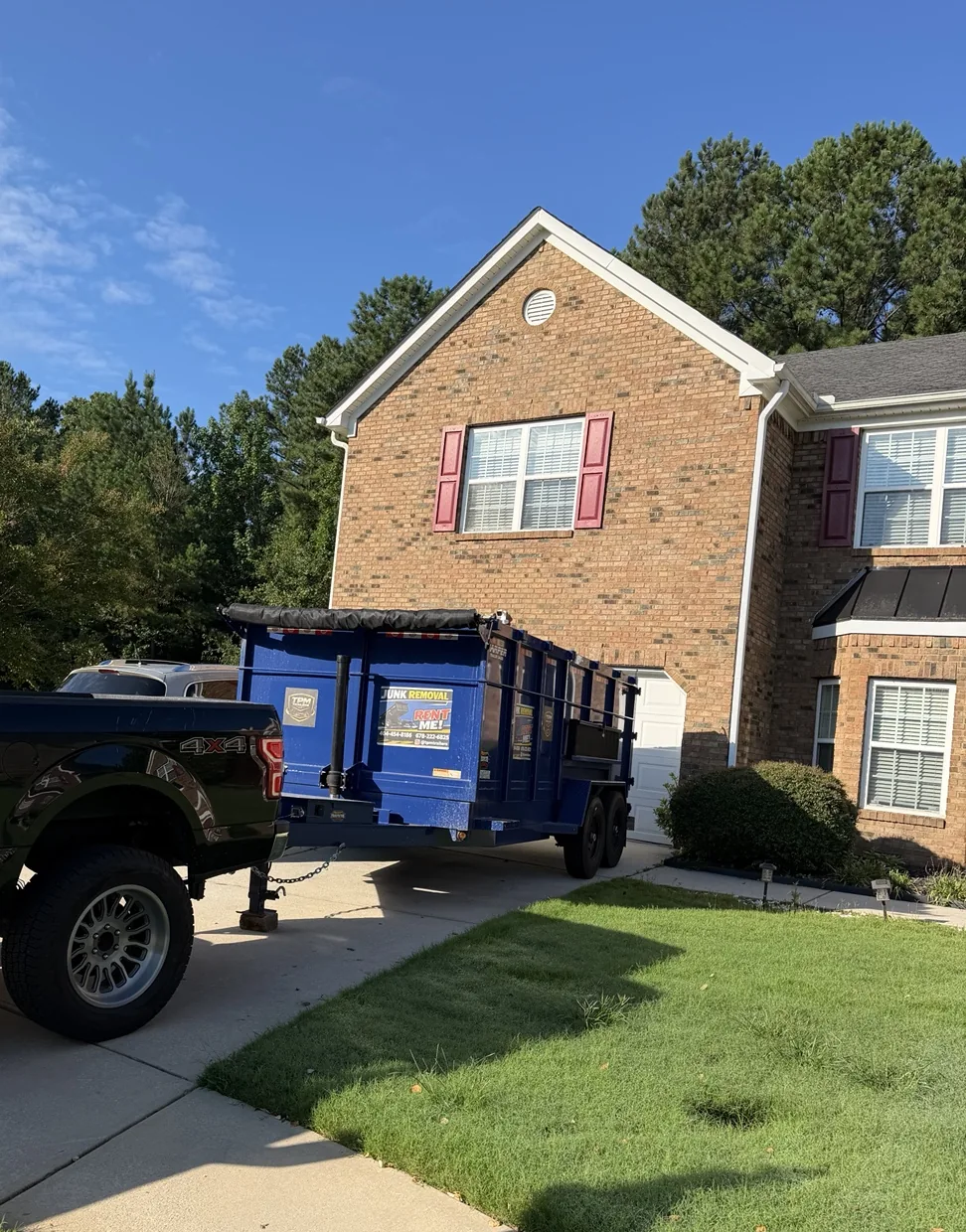 TPM Trailers truck and 20-yard dump trailer at a residential rental location in Metro Atlanta