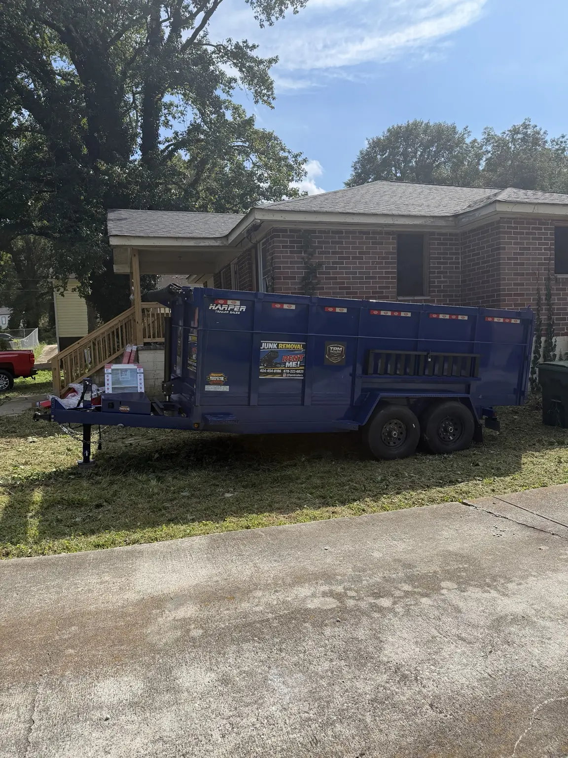 Side view of TPM dump trailer at Atlanta Georgia commercial renovation
