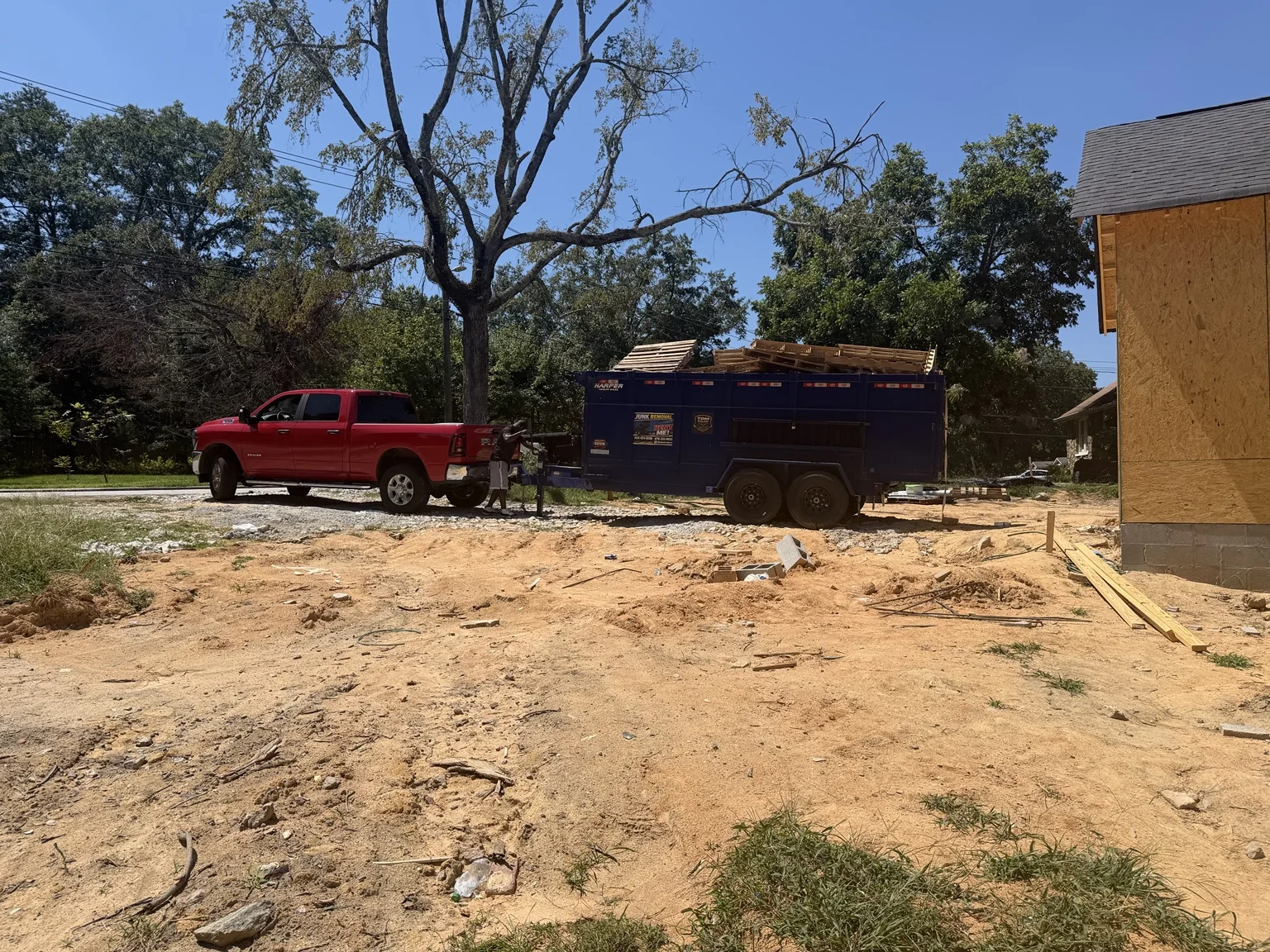 Ram heavy-duty pickup with TPM Trailers dump trailer at an active construction site