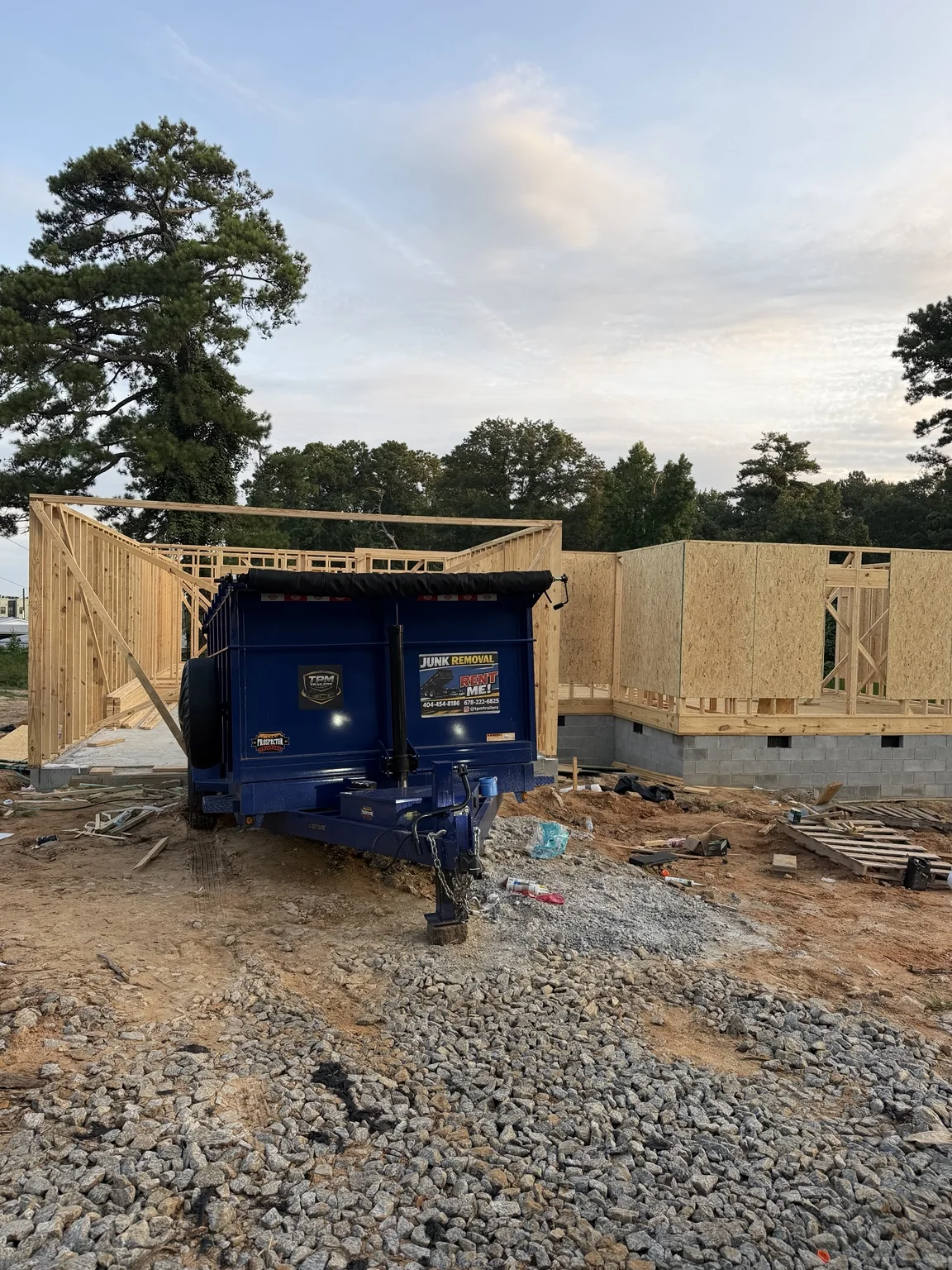 TPM Trailers at an active Douglasville new construction job site with residential framing in progress