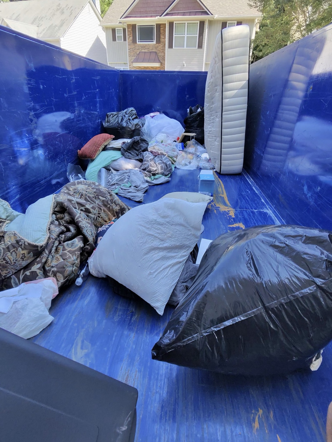 Two-load residential cleanout project in Hiram Georgia using a TPM 16-yard dump trailer